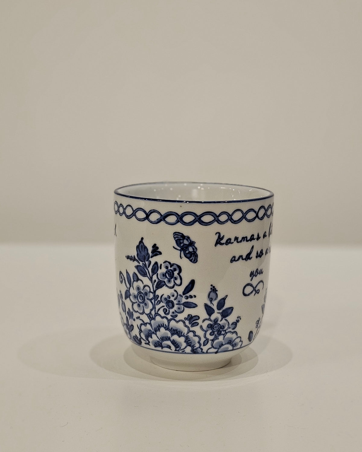 Karmas a bitch Mug